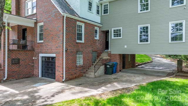 625 4th Street Dr NW, Hickory, NC 28601 - view of home's exterior with concrete driveway, brick siding, and a garage