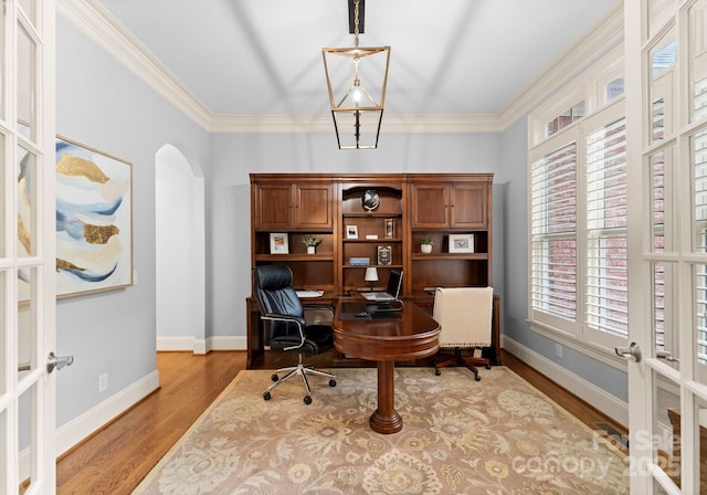 13420 Robert Walker Dr, Davidson, NC 28036 - home office featuring arched walkways, french doors, wood finished floors, and baseboards