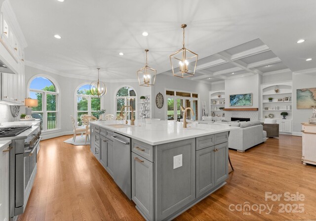 13420 Robert Walker Dr, Davidson, NC 28036 - kitchen with stainless steel appliances, gray cabinetry, a sink, and a notable chandelier