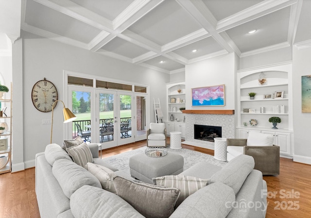 13420 Robert Walker Dr, Davidson, NC 28036 - living area featuring french doors, a tiled fireplace, built in features, baseboards, and beamed ceiling