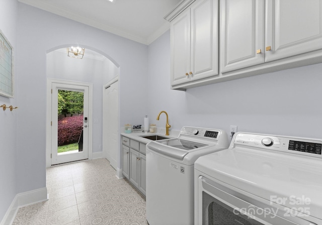 13420 Robert Walker Dr, Davidson, NC 28036 - laundry area featuring a sink, arched walkways, cabinet space, baseboards, and independent washer and dryer