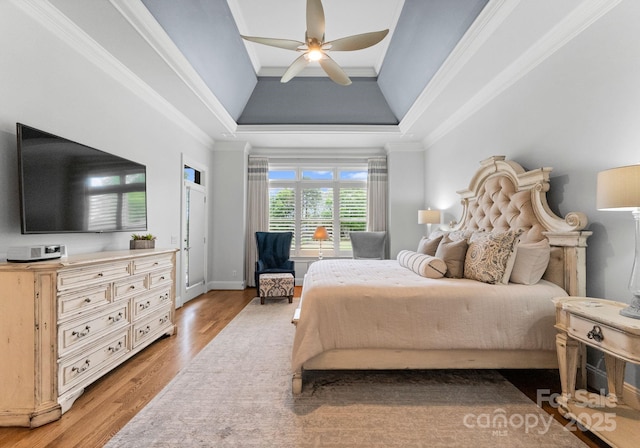 13420 Robert Walker Dr, Davidson, NC 28036 - bedroom featuring light wood-type flooring, ceiling fan, ornamental molding, and a raised ceiling