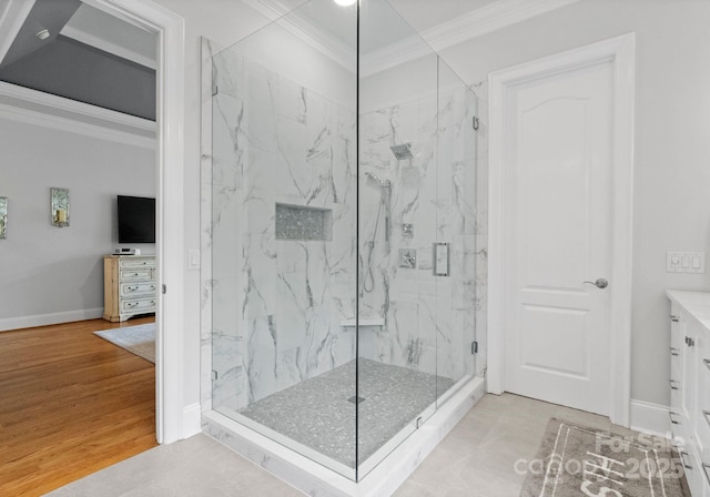 13420 Robert Walker Dr, Davidson, NC 28036 - bathroom with baseboards, crown molding, vanity, and a marble finish shower