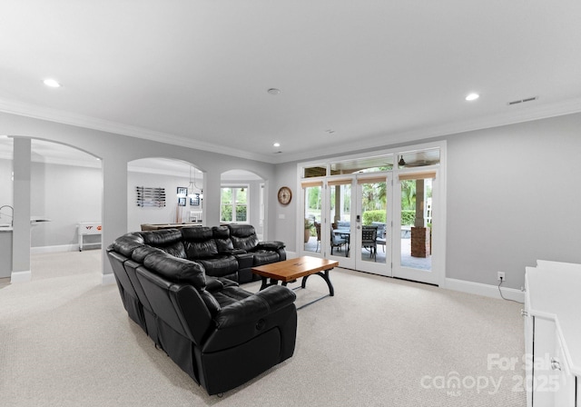 13420 Robert Walker Dr, Davidson, NC 28036 - living area with light carpet, visible vents, recessed lighting, and crown molding