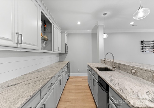 13420 Robert Walker Dr, Davidson, NC 28036 - kitchen with crown molding, a sink, light wood-style flooring, white cabinets, and appliances with stainless steel finishes