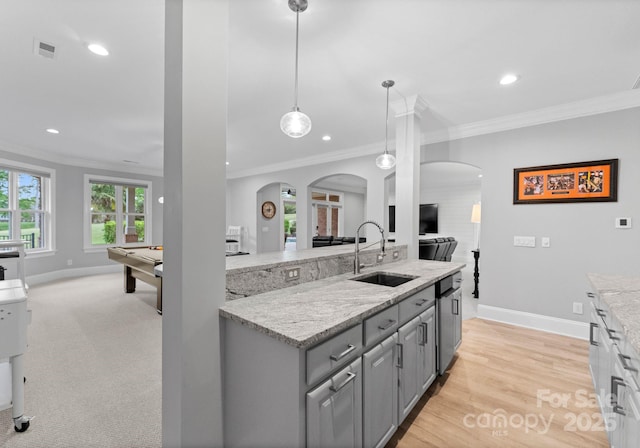 13420 Robert Walker Dr, Davidson, NC 28036 - kitchen with arched walkways, open floor plan, gray cabinetry, and a sink