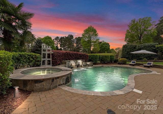 13420 Robert Walker Dr, Davidson, NC 28036 - pool at dusk with an outdoor pool, a patio, and an in ground hot tub