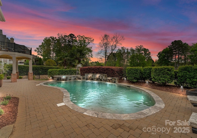 13420 Robert Walker Dr, Davidson, NC 28036 - pool at dusk featuring a patio area and a pool with connected hot tub