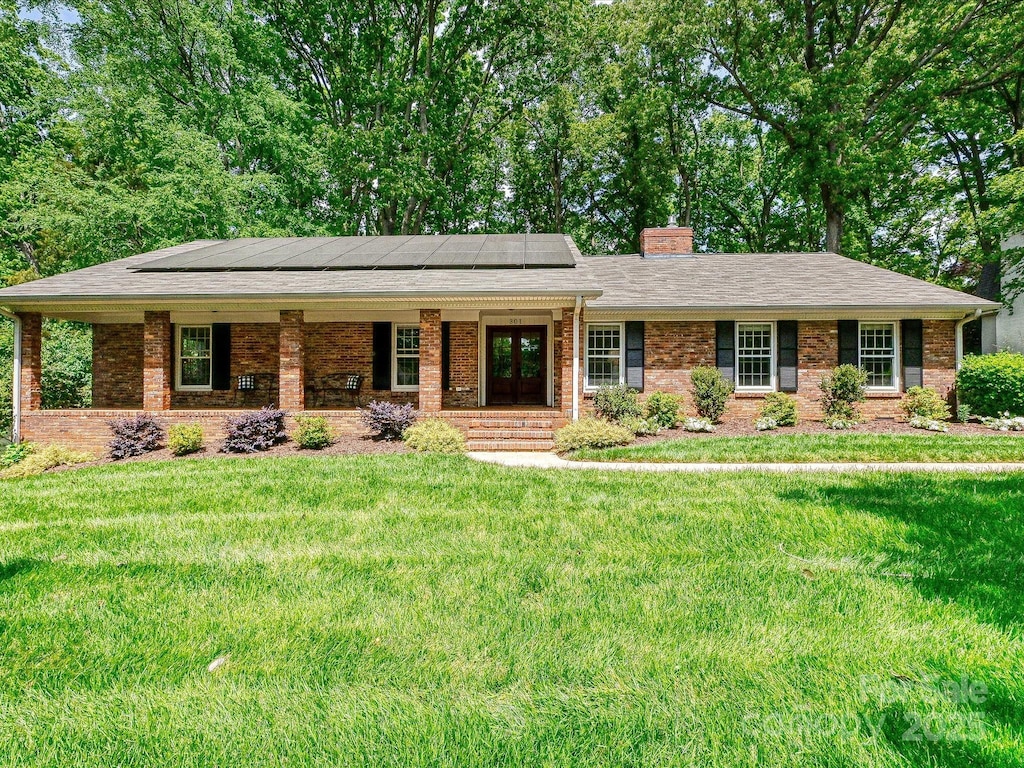 301 Glen Oaks Rd, Charlotte, NC 28270 - single story home featuring french doors, a front lawn, a chimney, and brick siding