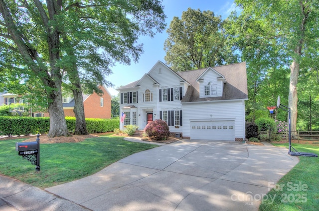 view of front of property with crawl space, driveway, a front yard, a garage, and fence