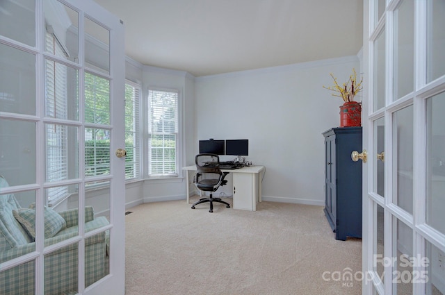 office space with french doors, baseboards, plenty of natural light, and light colored carpet