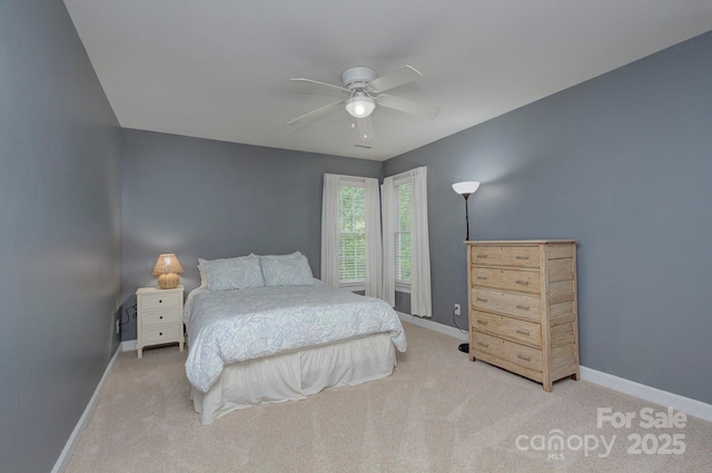 bedroom with baseboards, carpet, and ceiling fan