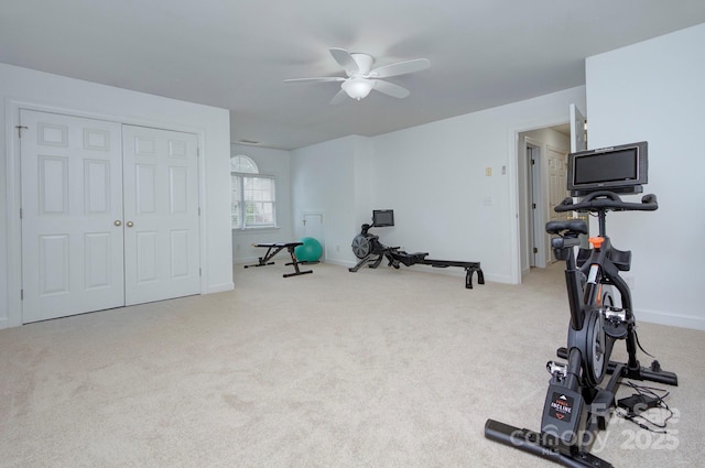 workout area with baseboards, carpet flooring, and ceiling fan