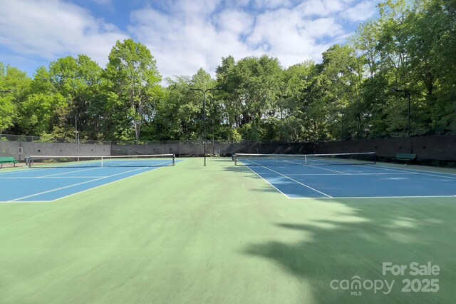 view of sport court featuring fence and community basketball court
