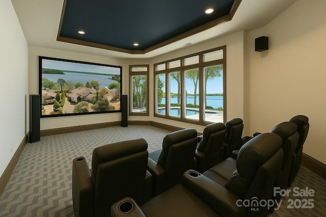 102 Eastham Ct, Mooresville, NC 28117 - carpeted cinema featuring baseboards, a tray ceiling, recessed lighting, and plenty of natural light