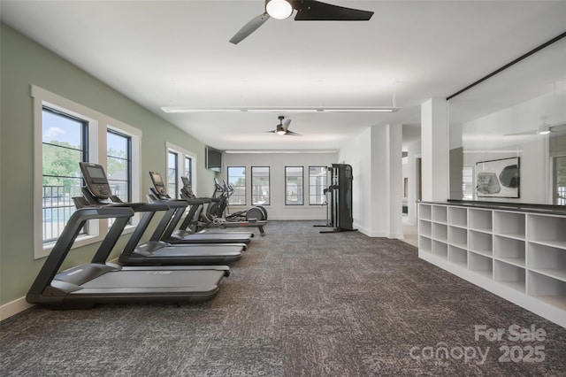 gym with carpet floors, baseboards, and ceiling fan