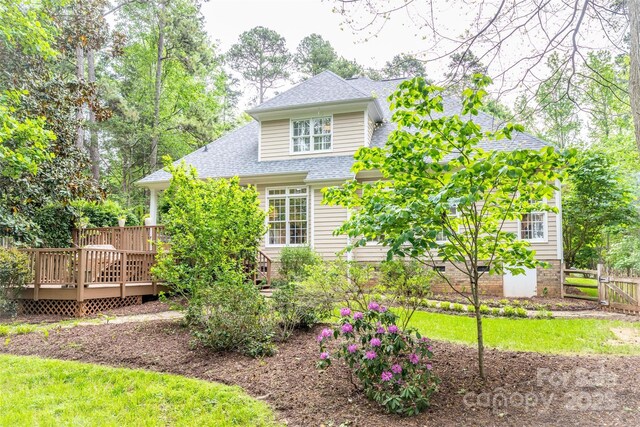 19729 Callaway Hills Ln, Davidson, NC 28036 - back of house with a wooden deck, fence, and a shingled roof