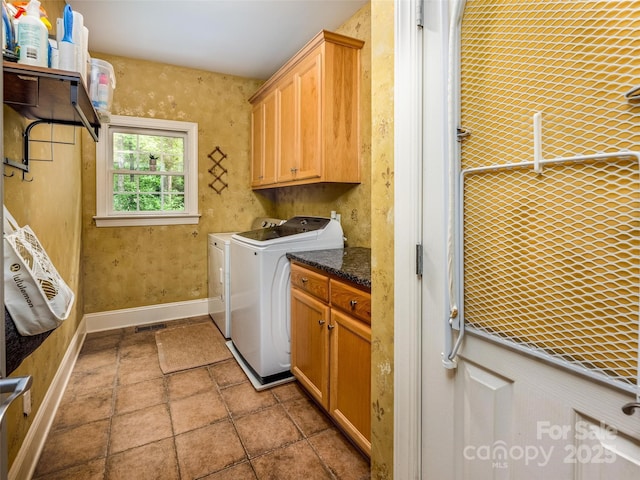19729 Callaway Hills Ln, Davidson, NC 28036 - laundry area featuring baseboards, independent washer and dryer, stone finish flooring, and cabinet space