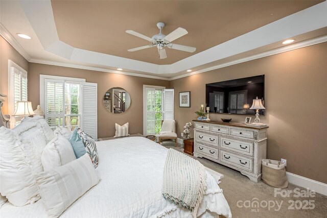 19729 Callaway Hills Ln, Davidson, NC 28036 - carpeted bedroom featuring multiple windows, recessed lighting, a raised ceiling, and crown molding