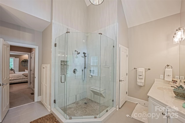 19729 Callaway Hills Ln, Davidson, NC 28036 - ensuite bathroom featuring a shower stall, connected bathroom, vanity, baseboards, and tile patterned flooring