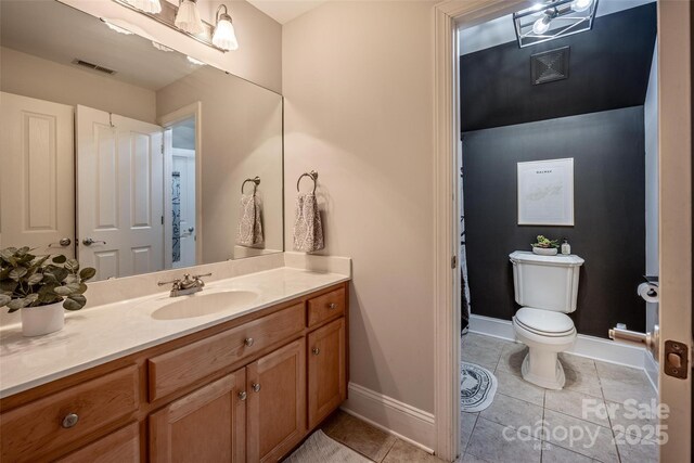 19729 Callaway Hills Ln, Davidson, NC 28036 - bathroom with toilet, baseboards, visible vents, tile patterned flooring, and vanity