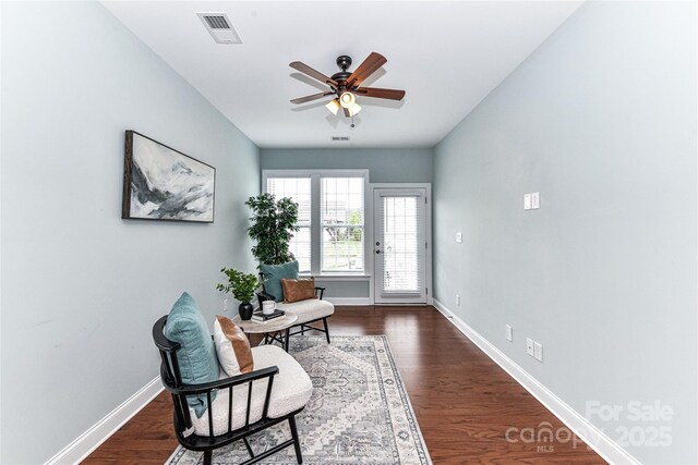 11123 Bailey Park Nature Dr, Cornelius, NC 28031 - living area with dark wood finished floors, baseboards, a ceiling fan, and visible vents