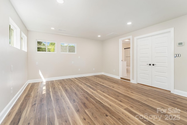 112 Circle Dr, Salisbury, NC 28144 - spare room featuring wood finished floors, baseboards, and recessed lighting