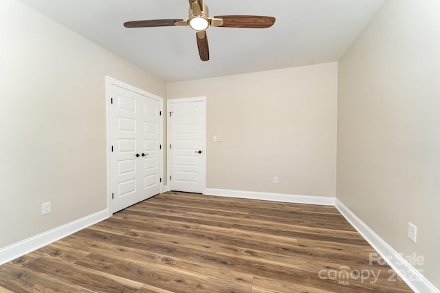 112 Circle Dr, Salisbury, NC 28144 - spare room featuring baseboards, dark wood-type flooring, and ceiling fan