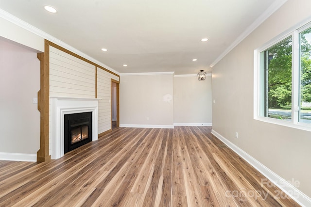 112 Circle Dr, Salisbury, NC 28144 - unfurnished living room with wood finished floors, recessed lighting, baseboards, a large fireplace, and crown molding