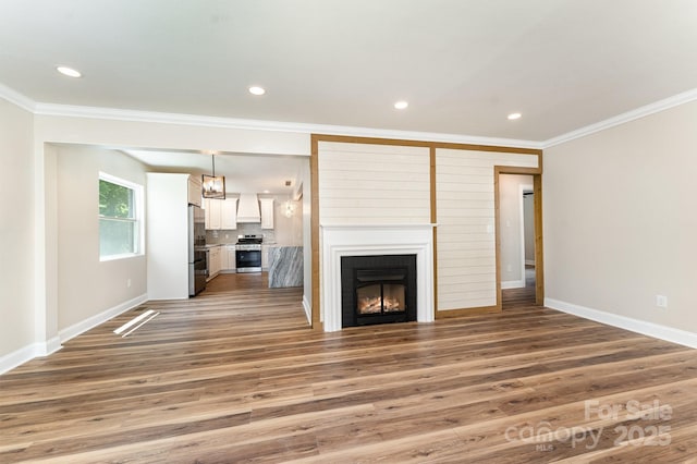 112 Circle Dr, Salisbury, NC 28144 - unfurnished living room featuring baseboards, light wood finished floors, ornamental molding, a large fireplace, and recessed lighting