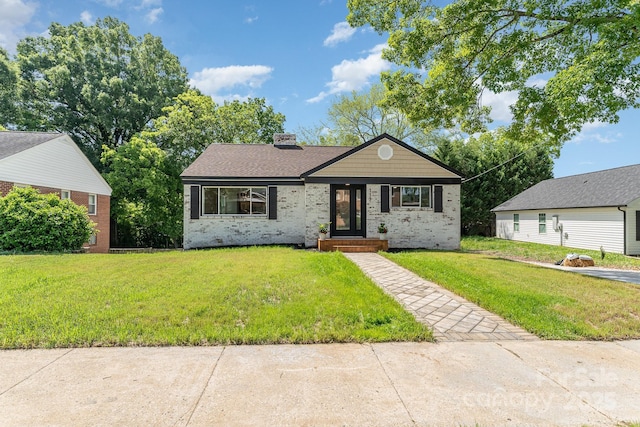 112 Circle Dr, Salisbury, NC 28144 - view of front of property with brick siding, a front yard, a chimney, and a shingled roof