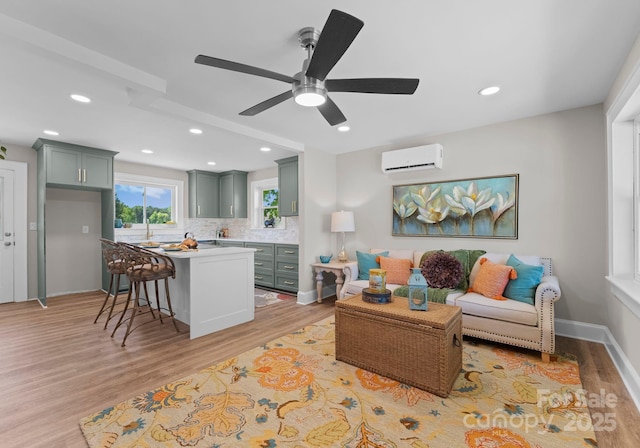 155 Jackson Rd, Salisbury, NC 28146 - living room featuring ceiling fan, light wood-type flooring, baseboards, an AC wall unit, and recessed lighting