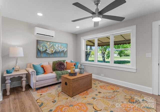 155 Jackson Rd, Salisbury, NC 28146 - living area with wood finished floors, recessed lighting, baseboards, and a wall unit AC