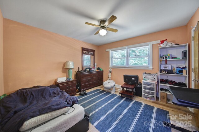 bedroom featuring a ceiling fan and wood finished floors