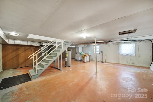 basement with stairs and water heater