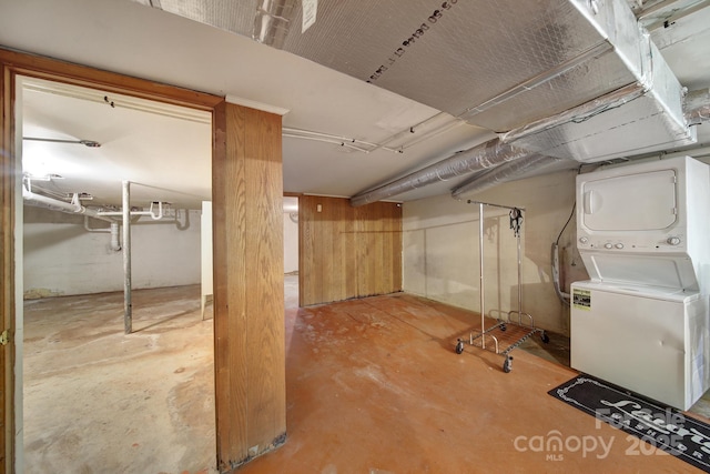 finished basement with stacked washer / dryer