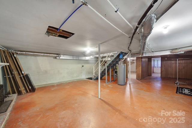 below grade area featuring stairway and gas water heater