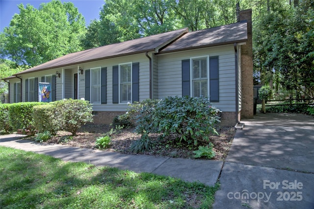 10708 Danesway Ln, Cornelius, NC 28031 - view of side of property with fence and a chimney