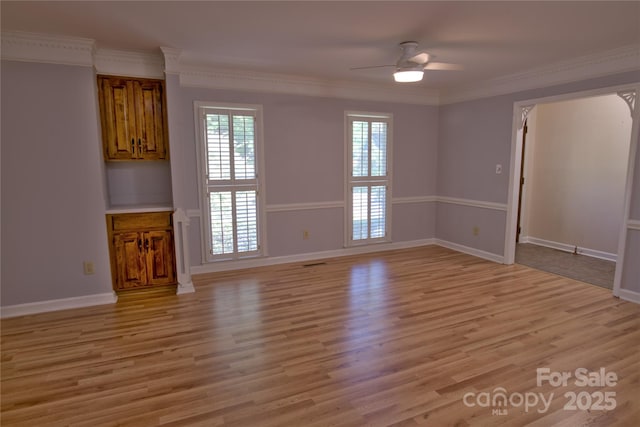 10708 Danesway Ln, Cornelius, NC 28031 - unfurnished living room with light wood-type flooring, ornamental molding, baseboards, and ceiling fan