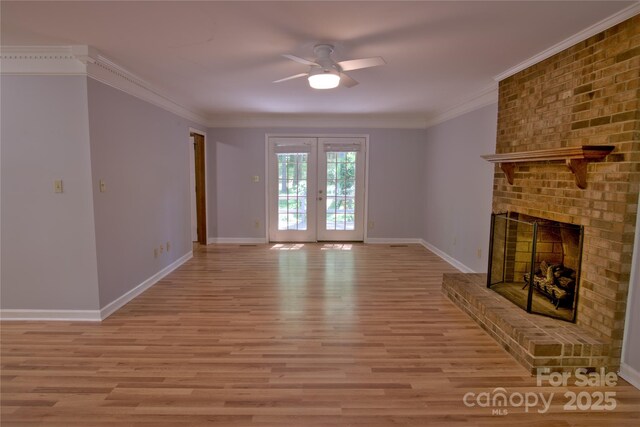 10708 Danesway Ln, Cornelius, NC 28031 - unfurnished living room with a ceiling fan, light wood-type flooring, french doors, baseboards, and a brick fireplace