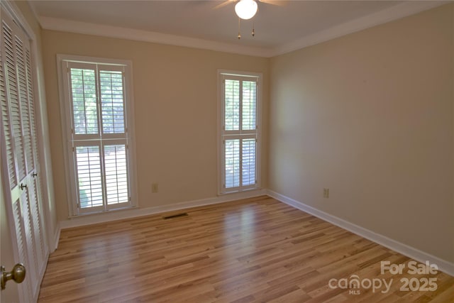 10708 Danesway Ln, Cornelius, NC 28031 - spare room featuring light wood-style flooring, a wealth of natural light, baseboards, and ceiling fan