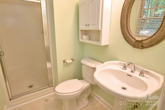 10708 Danesway Ln, Cornelius, NC 28031 - full bath featuring a shower stall, tile patterned flooring, toilet, a sink, and baseboards