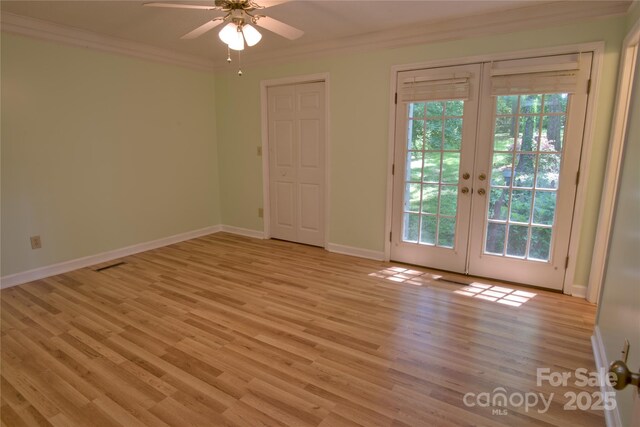 10708 Danesway Ln, Cornelius, NC 28031 - unfurnished room featuring ceiling fan, a wealth of natural light, ornamental molding, and french doors