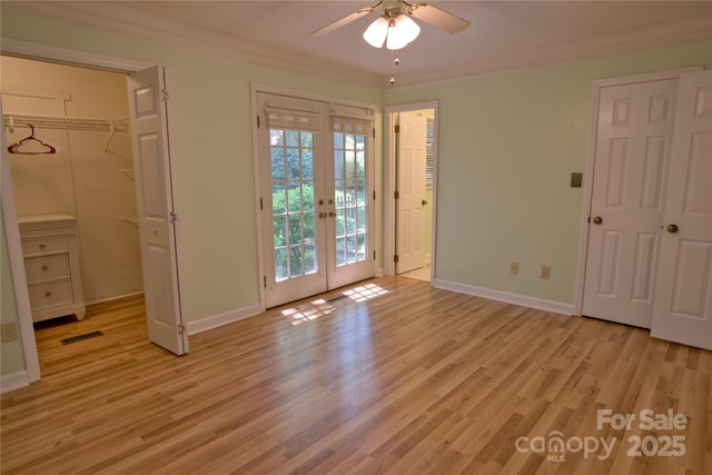 10708 Danesway Ln, Cornelius, NC 28031 - unfurnished bedroom with light wood finished floors, baseboards, visible vents, and crown molding