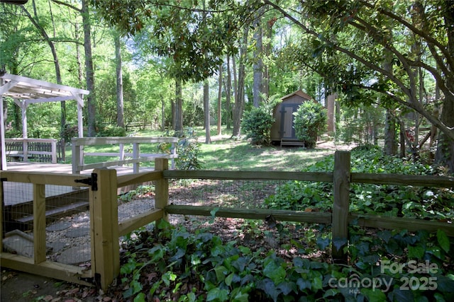 10708 Danesway Ln, Cornelius, NC 28031 - view of yard with a pergola, a storage unit, and an outdoor structure