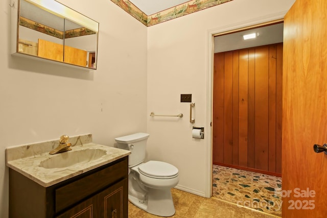 675 Rodgers Rd, Newland, NC 28657 - bathroom with toilet, vanity, and baseboards