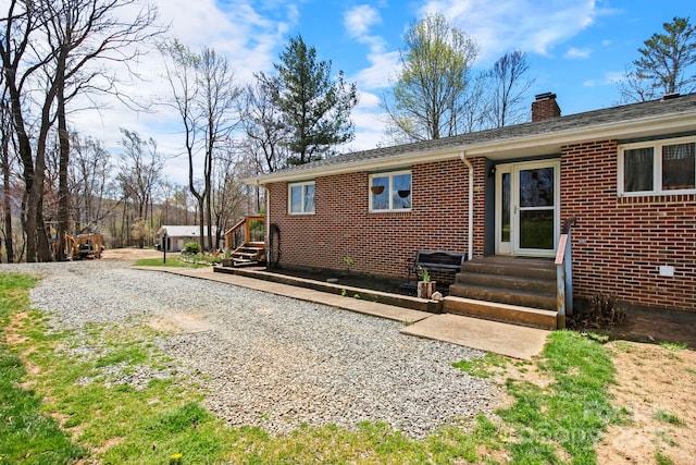 675 Rodgers Rd, Newland, NC 28657 - rear view of property featuring brick siding and a chimney