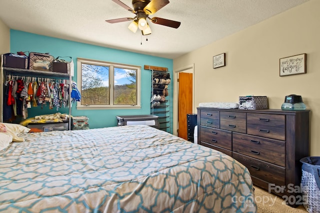 675 Rodgers Rd, Newland, NC 28657 - carpeted bedroom with a textured ceiling and ceiling fan