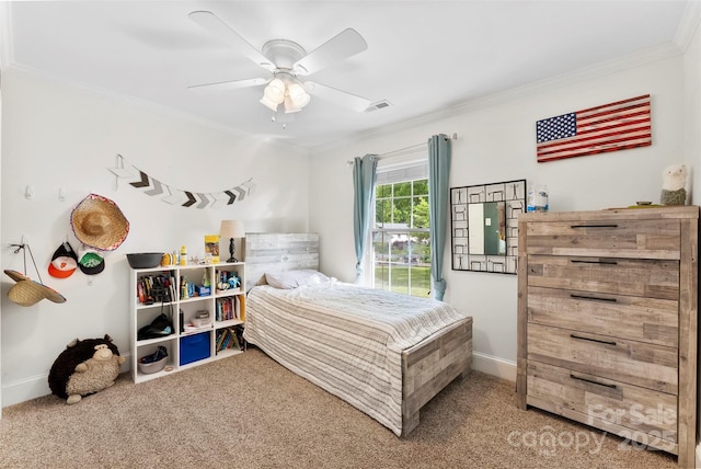 carpeted bedroom featuring a ceiling fan, baseboards, visible vents, and ornamental molding