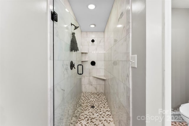 full bathroom featuring toilet, recessed lighting, and a stall shower